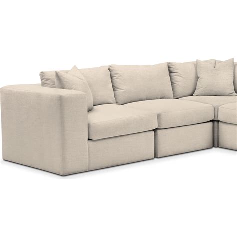 Collin sectional american signature - The Luxe Sectional may be the most comfortable piece yet. The Luxe combines a signature sleek design aesthetic with layers of absolute comfort and is built to withstand the rowdiest of families. Get lost in a deep-seated, corded piece of heaven. Seating Capacity: 5; Cushion Construction: Fiber Wrapped Foam; Sofa Design: Stationary 